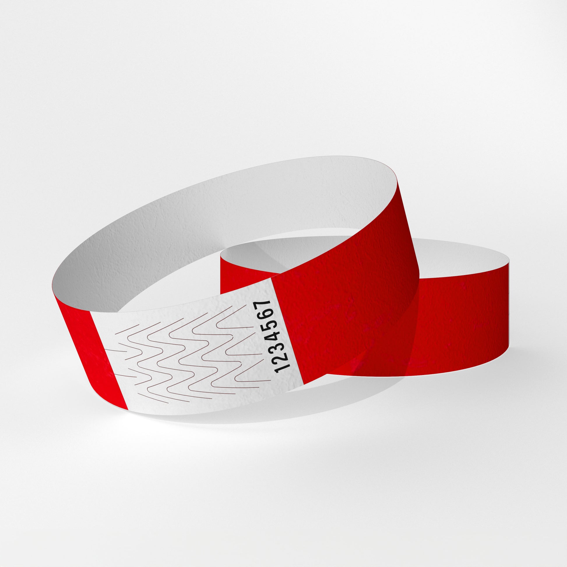 Das Bild zeigt zwei Tyvek-Kontrollarmbänder. Eines über dem anderen. Auf dem oberen Armband ist ein weißes Teil zu sehen, das ein Verschluss aus Klebstoff ist, der beim Abnehmen des Armbands reißt.